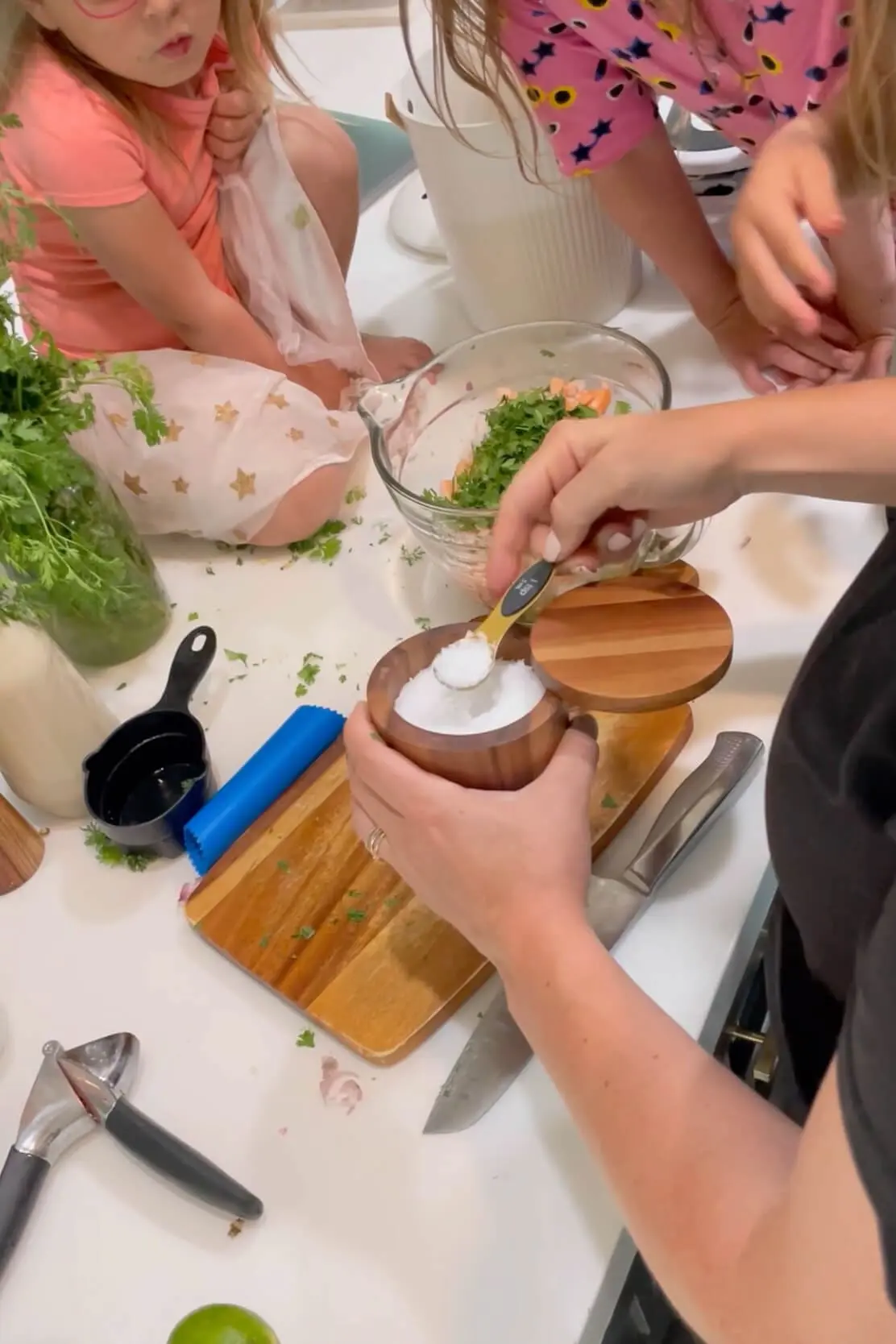 Adding salt and pepper to my ceviche recipe.